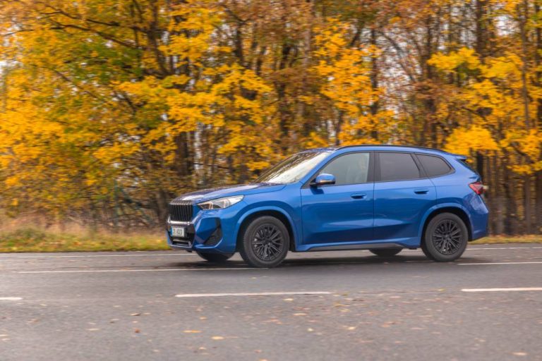 blue crossover driving autumn road side view car motion 1